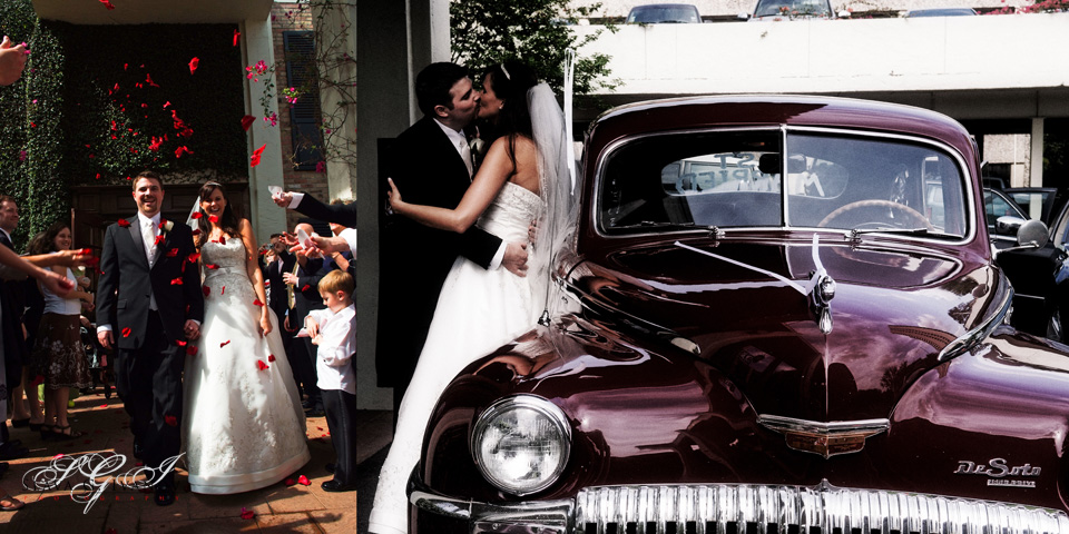 Bride and groom kissing at the get away car 